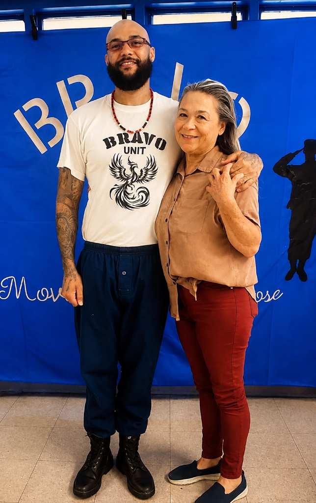 A Boot Camp participant in Bravo Unit uniform embracing his mother during visitation